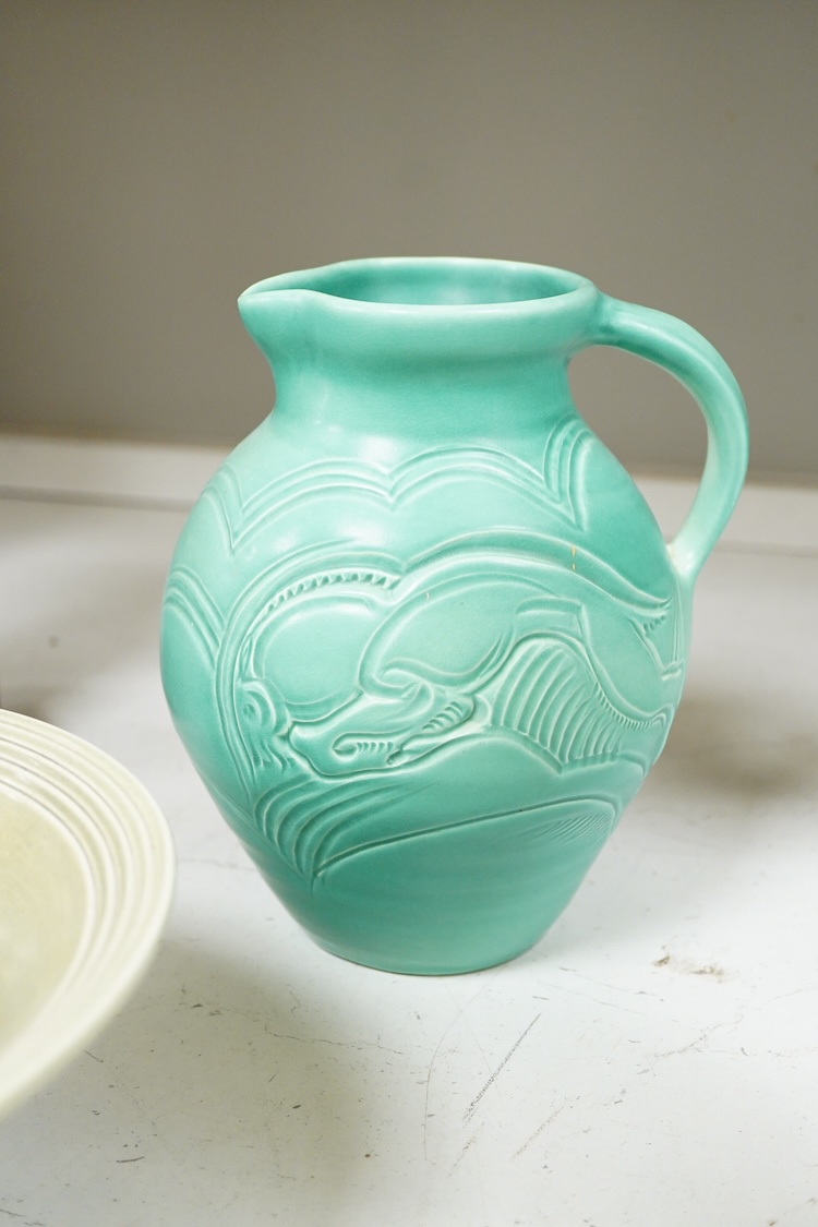 A Susie Cooper incised jug, 22cm high and similar bowl, each incised with animals (2)